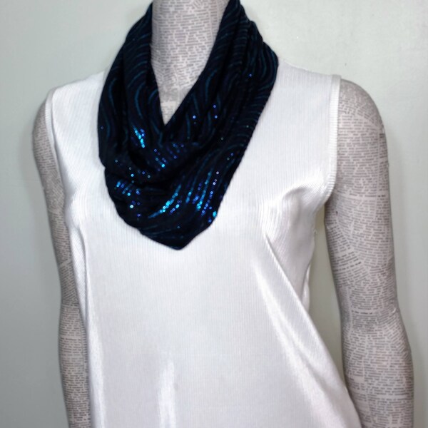 Blingy beautiful scarf of blue and turquoise glitter on a slinky black background.  Can be special occassion or to add bling to an outfit.*