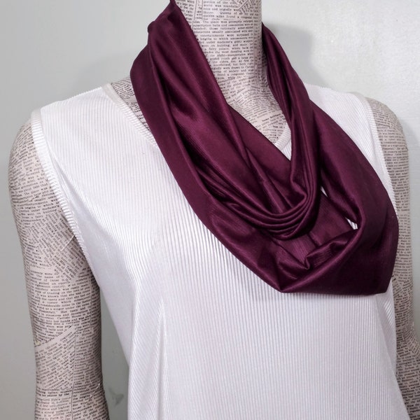 Mulberry plum aubergine eggplant solid color smooth slinky lightweight ladies infinity scarf of poly knit. Fluid drape modest size.