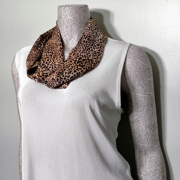 Ladies infinity scarf in brown and tan animal print on a very soft lightweight fabric.   Drapes nicely. Classy casual look.
