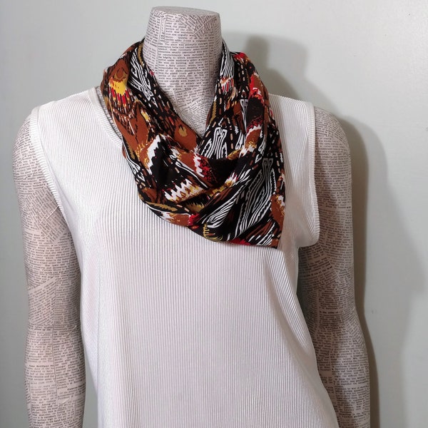 Southwestern - Aztec Abstract orange brown black and white design on a rayon ladies infinity scarf. Soft full drape. Casual sporty look.*