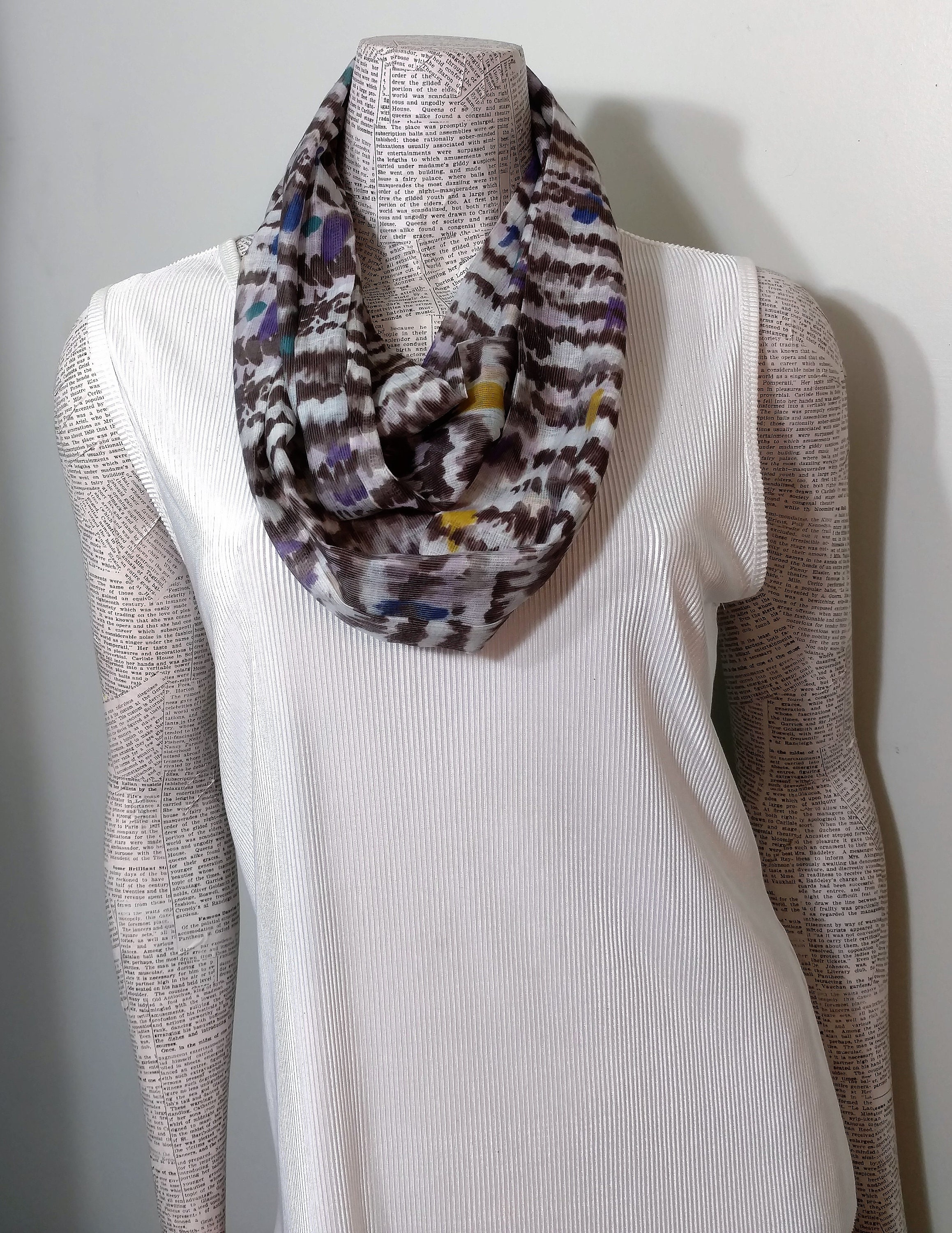Southwestern Casual sporty look.* Soft full drape Aztec Abstract orange brown black and white design on a rayon ladies infinity scarf