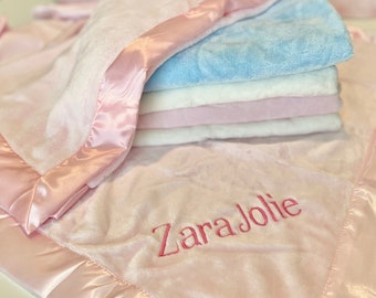 Personalized embroidered baby blanket with satin trim