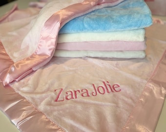 Personalized embroidered baby blanket with satin trim