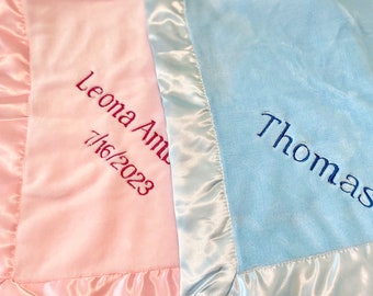 Personalized embroidered baby blanket with satin trim