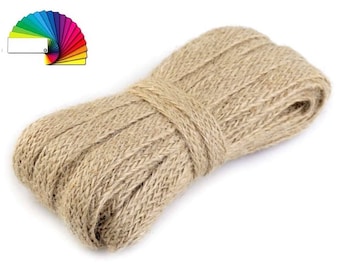 May include: A roll of natural brown jute twine, ideal for crafting, wrapping, and decorating.