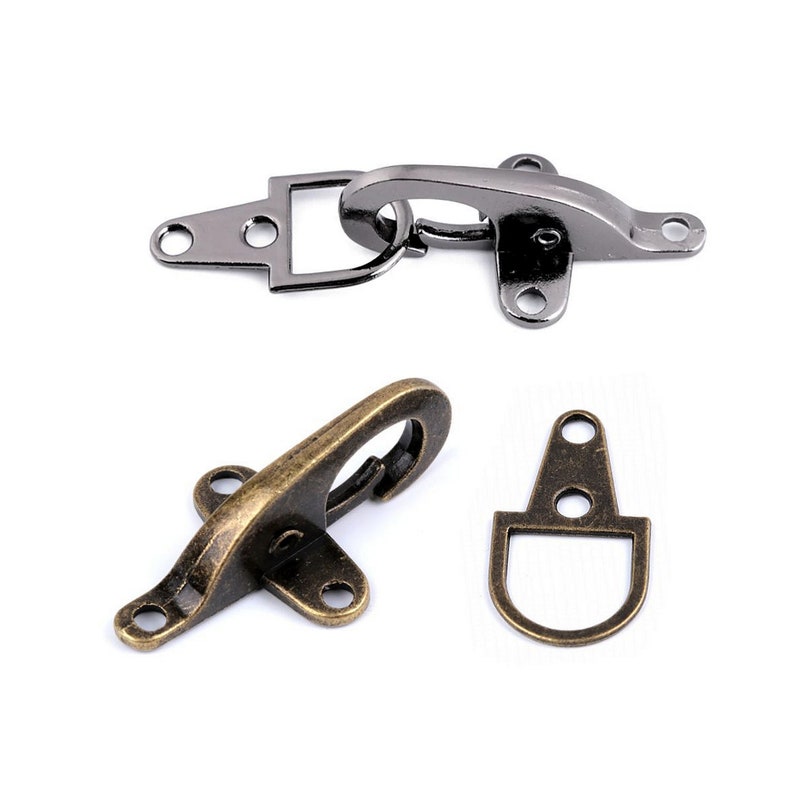 May include: Two sets of metal clasps, one in antique brass and one in black nickel. Each set includes a hook and a loop.