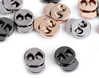 May include: Assortment of metal toggle clasps in silver, black, and gold finishes. Each clasp features two heart-shaped openings.