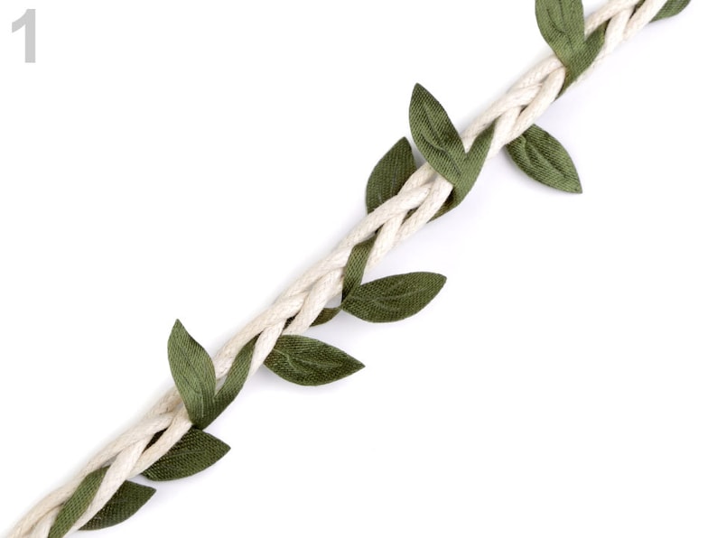 May include: A white braided rope with green fabric leaves attached. The rope is twisted and the leaves are evenly spaced.