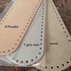 May include: Three leather pieces for crafting, in beige, light gray, and ivory. The beige piece is labeled "9 Poudre", the light gray piece is labeled "7 gris clair", and the ivory piece is labeled "ivoire".