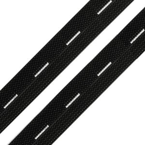 May include: Two black elastic buttonhole bands with white buttonhole slits. The bands are angled diagonally across a white background. The buttonholes are evenly spaced along the length of the bands. The bands are made of a woven material.