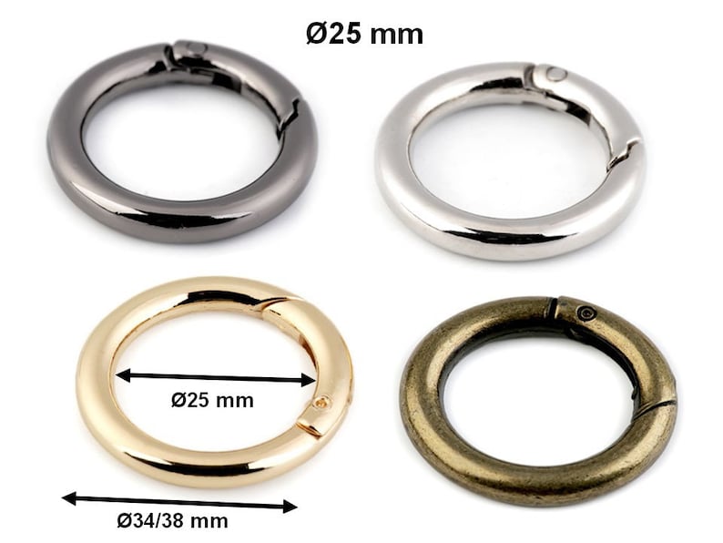 May include: Four metal key rings with a spring-loaded clasp. The rings are 25 mm in diameter and are shown in black, silver, gold, and bronze.