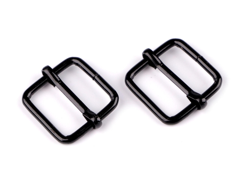 May include: Two black metal buckle closures. The buckles are rectangular with a center bar.