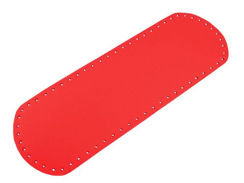 May include: Red leather craft piece with holes around the edges. This piece is used for making bags and other leather goods.