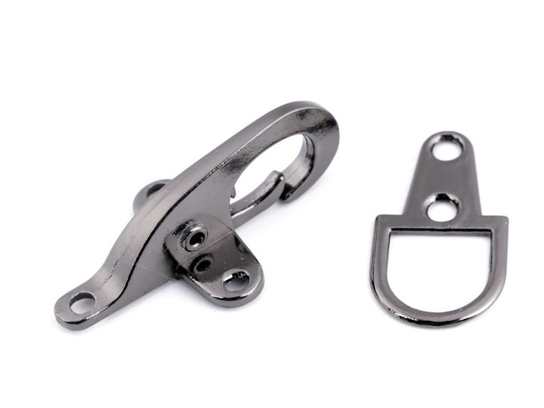 May include: A silver-toned metal hook and loop fastener set. The hook is a swiveling clasp with a D-ring. The loop is a D-ring with a flat base.
