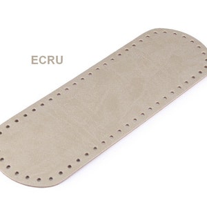 May include: A beige leather bag bottom with a stitched edge and holes for sewing. The text "ECRU" is printed on the image.
