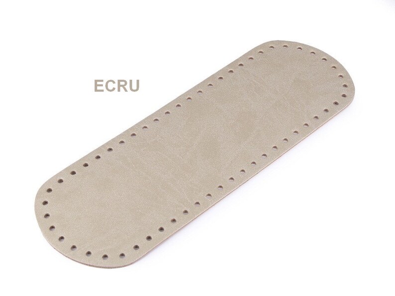 May include: A beige leather bag bottom with a stitched edge and holes for sewing. The text "ECRU" is printed on the image.