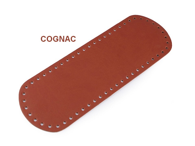 May include: A cognac brown leather strap with evenly spaced holes for stitching. The strap is rectangular with rounded edges.