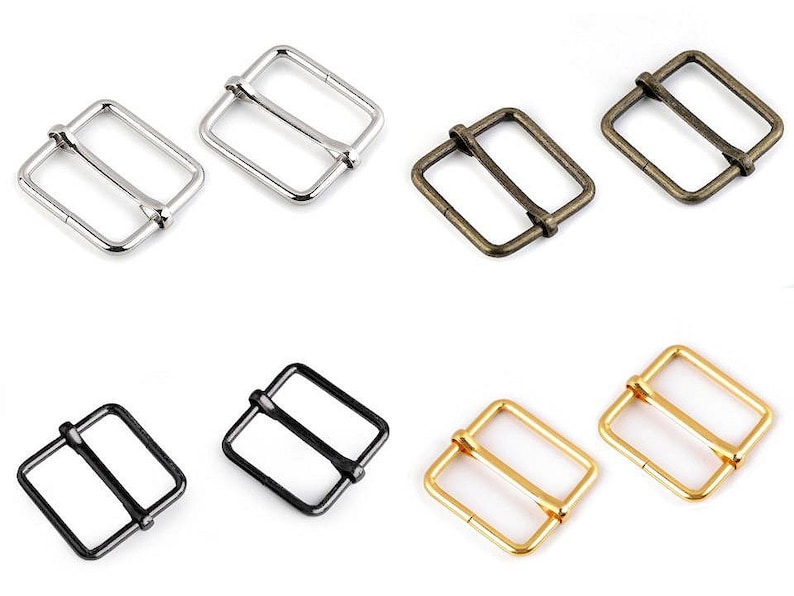 May include: Six metal buckle closures in various finishes, including silver, antique brass, black, and gold. The buckles are square shaped with a center bar.