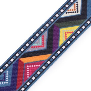 May include: Blue, red, yellow, green, and purple geometric patterned ribbon with a white and black border.