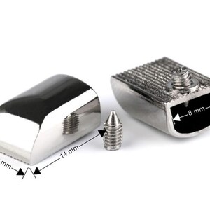 May include: Silver-toned metal furniture end caps with a screw-on design. The end caps measure 10 mm by 14 mm and 8 mm by 7 mm.