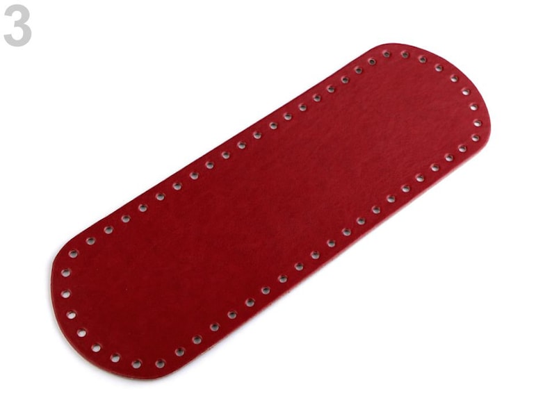 May include: Red leather strap with holes around the edges. The strap is about 12 inches long and 2 inches wide.