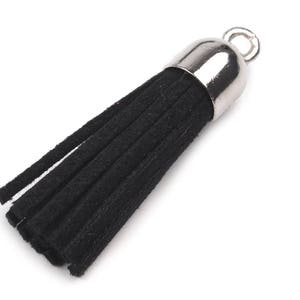 May include: Black tassel with a silver metal top and a loop for attaching to a bag or keychain.