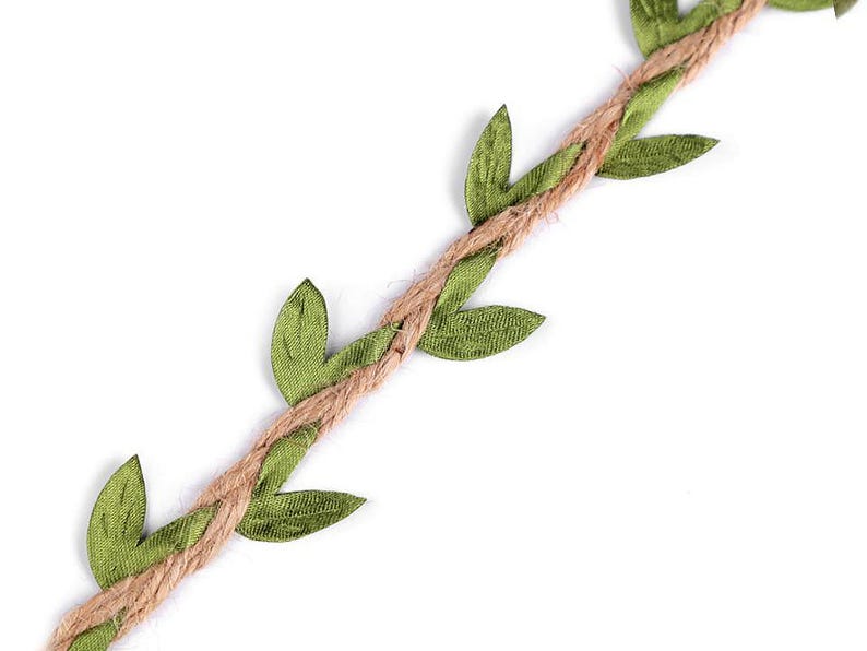 May include: A close-up of a brown jute twine with green fabric leaves attached. The twine is twisted and the leaves are arranged in a repeating pattern.