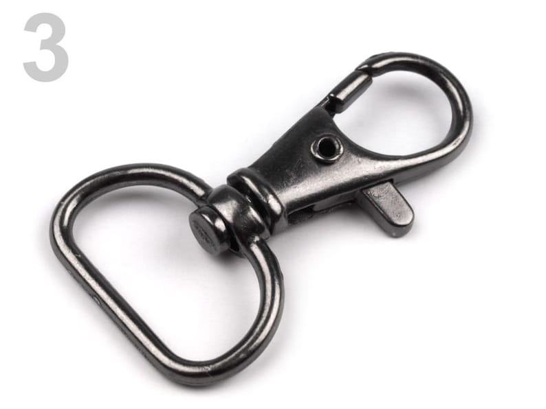 May include: A black metal swivel hook with a D-ring. The hook is closed and ready to be attached to a bag, keychain, or other item.