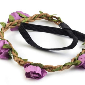 May include: A purple flower crown headband with a brown braided rope base and an elastic band.