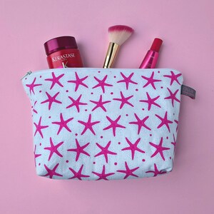 Cosmetic Makeup Bag in pink starfish coastal beach design: 100% cotton, waterproof lining