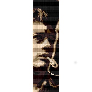 May include: A black and white beaded portrait of a man with a cigarette in his mouth. The man is wearing a dark shirt and has a serious expression on his face.