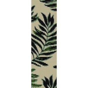 May include: A beaded bracelet with a pattern of green leaves on a beige background.