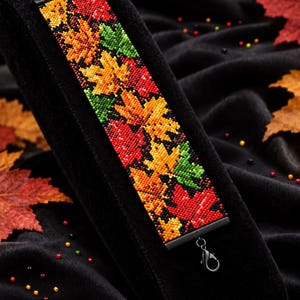 May include: A beaded bracelet featuring a pattern of red, orange, yellow, and green maple leaves on a black background. The text reads Bracelet Bead Pattern, PDF, Instant Download, PEYOTE STITCH, Miyuki Delica 11/0, Color Chart, Word Chart.