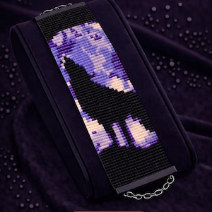 May include: A black beaded bracelet with a pattern in shades of purple and white, displayed on a dark purple velvet surface. The text "Bracelet Bead Pattern" and "LOOM STITCH" are visible. The bracelet is made with Miyuki Delica 11/0 beads.