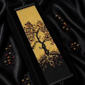 May include: A loom stitch bracelet bead pattern PDF instant download featuring a tree design in gold, black, and red beads. The text reads Bracelet Bead Pattern, PDF Instant Download, LOOM STITCH, and Miyuki Delica 11/0 Color Chart Word Chart.