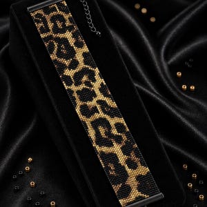 May include: A beaded bracelet featuring a black and gold leopard print pattern, finished with black metal end bars and a lobster clasp. The text reads Bracelet Bead Pattern, PDF, Instant Download, PEYOTE STITCH, Miyuki Delica 11/0, Color Chart, Word Chart.