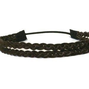 May include: A dark brown braided headband with a black elastic band. The headband features a double-braided design, with a soft, textured appearance. The accessory is designed for hair styling and fashion.