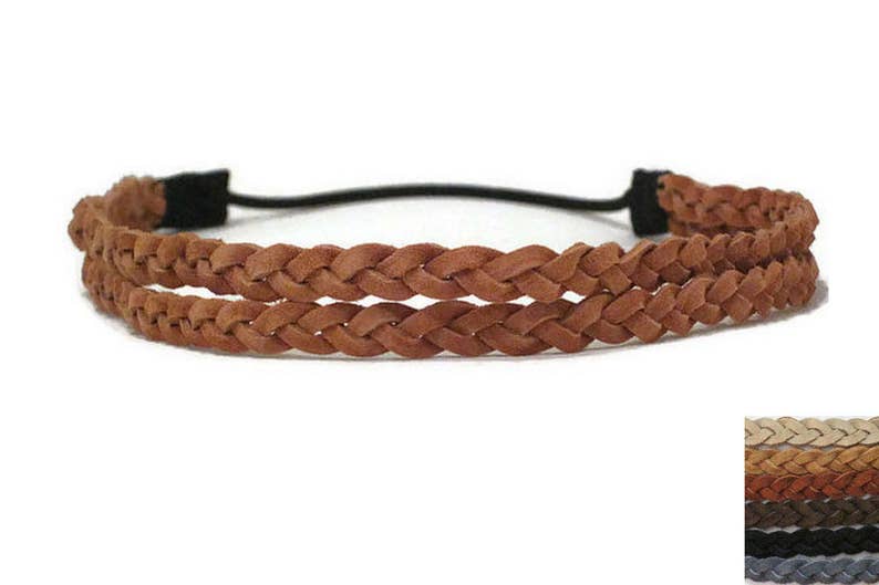May include: A brown braided leather headband with a black elastic band. The headband features two rows of braided leather and is designed for comfortable wear. This accessory is suitable for various hairstyles.