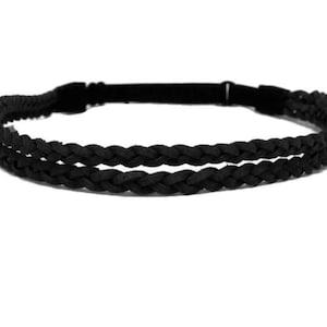 May include: Black braided headband with an adjustable elastic band. The headband features two parallel rows of braided material, creating a textured and stylish accessory. The design is simple and versatile, suitable for various hairstyles and occasions.