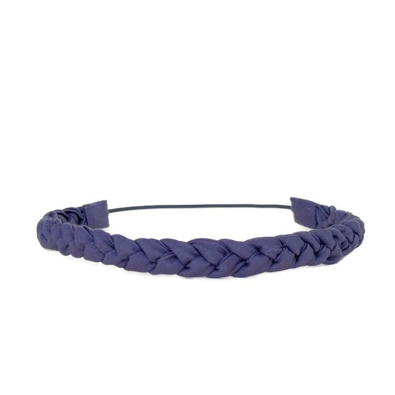 May include: A dark blue headband featuring a braided fabric design that spans the entire length of the band. The accessory has a smooth, matte texture and a flexible, thin frame that connects the braided ends, creating a continuous circular shape.