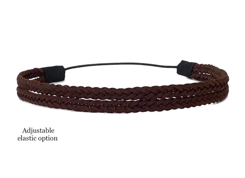 May include: A brown braided headband with an adjustable elastic band. The headband features a double-braided design in a rich, dark brown color. The text "Adjustable elastic option" is visible.