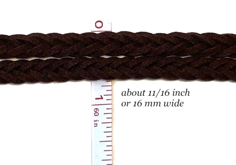 May include: Close-up of two strands of dark brown braided cord. A ruler indicates the cord is about 11/16 inch wide. The text on the image says the cord is about 11/16 inch or 16 mm wide. The cord appears to be made of suede or a similar material.