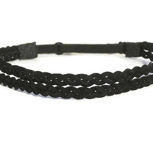 May include: A black braided headband with two rows of woven material. The headband is made of a soft, flexible material and has an adjustable strap for a comfortable fit. This accessory is suitable for various hairstyles.