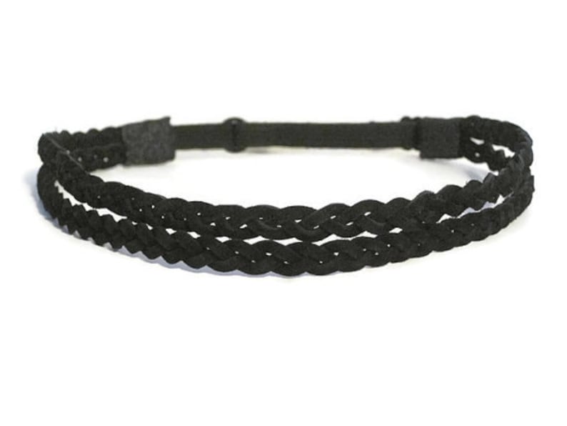 May include: A black braided headband with two rows of woven material. The headband is made of a soft, flexible material and has an adjustable strap for a comfortable fit. This accessory is suitable for various hairstyles.