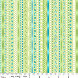 May include: A fabric pattern featuring vertical stripes in shades of green, white, and teal. The stripes are adorned with various designs, including snowflakes, dots, and geometric shapes. The text "Riley Blake Designs" is visible at the bottom.