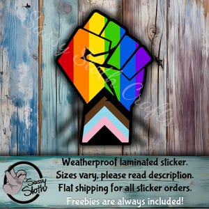 May include: A rainbow fist with a transgender pride flag on the forearm. The fist is raised in the air, symbolizing strength and solidarity. Weatherproof laminated sticker. Sizes vary, please read description. Flat shipping for all sticker orders. Freebies are always included!
