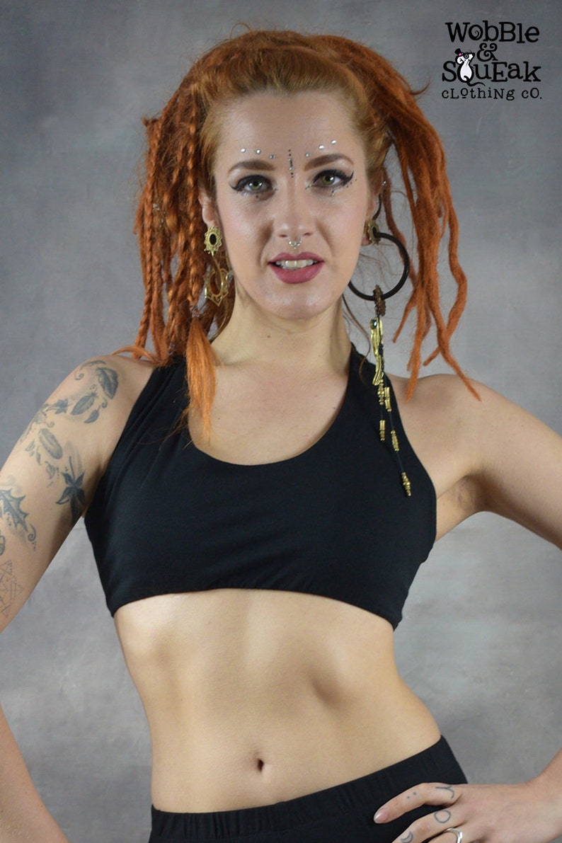 ​Front View (black ): Deep black and scoop neck yoga bra showing the supportive front fit and sleeveless artisanal design on a model