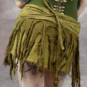 back view of a marsala fringed skirt with a lace waistband. The skirt is tied at the back with a long, flowing tie.