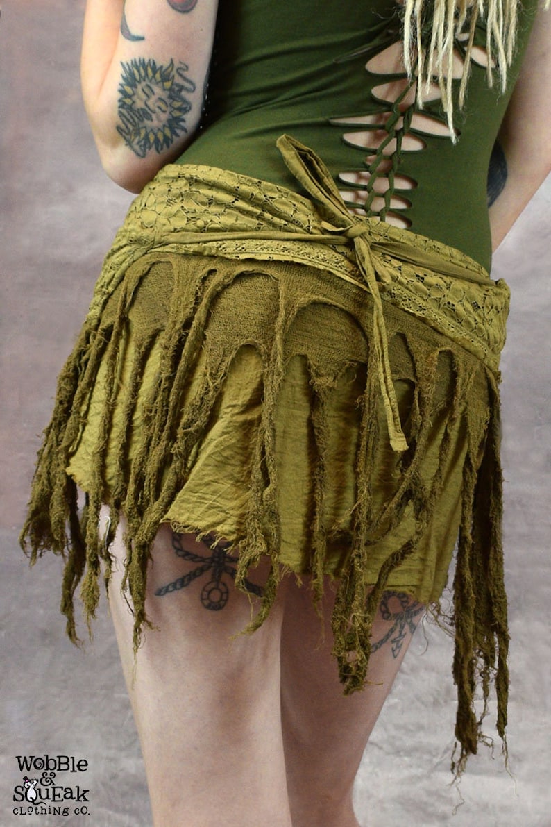 back view of a marsala fringed skirt with a lace waistband. The skirt is tied at the back with a long, flowing tie.