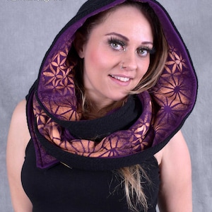 May include: A black hooded scarf with a purple and orange geometric pattern. The scarf is made of a soft, comfortable fabric and is perfect for keeping warm in the winter.